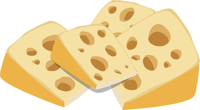 Dibujo de unos pedazo de quesos amarillos con agujeros en su interior.